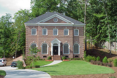 Example of a huge classic red two-story brick gable roof design in Atlanta
