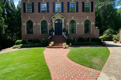 Example of a large classic multicolored three-story brick exterior home design in Atlanta with a shingle roof