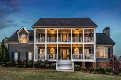 Example of a large classic two-story concrete fiberboard exterior home design in Atlanta