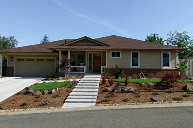 Medium sized and gey classic bungalow detached house in Sacramento with wood cladding, a hip roof and a metal roof.