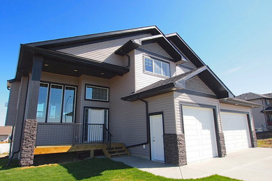 Inspiration for a craftsman brown two-story vinyl exterior home remodel in Calgary