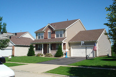 Example of a two-story exterior home design in Chicago