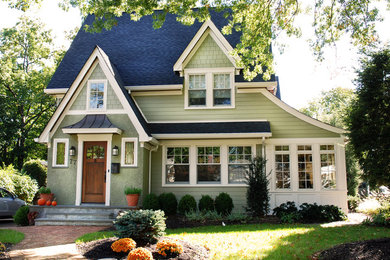 Large craftsman green two-story wood house exterior idea in New York with a shingle roof