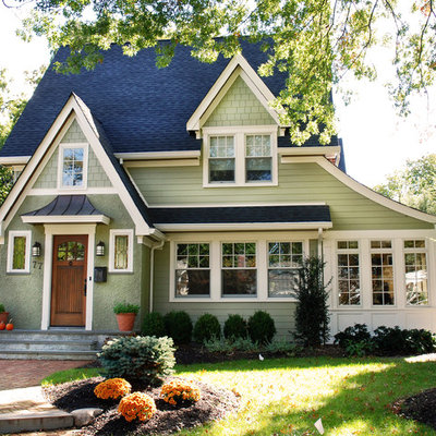 Large craftsman green two-story wood house exterior idea in New York with a shingle roof