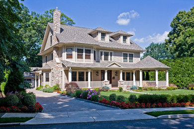 Example of a large transitional beige three-story wood gable roof design in New York