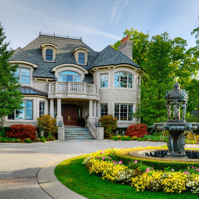 Example of a classic stone exterior home design in Detroit