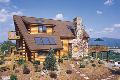 Inspiration for a mid-sized rustic brown two-story wood gable roof remodel in Denver
