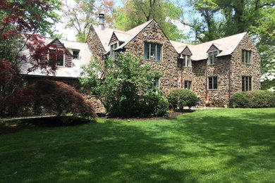 Example of a classic brown two-story stone exterior home design in Philadelphia