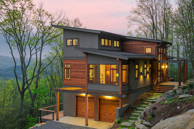 Design ideas for a contemporary house exterior in Chicago with wood cladding and a lean-to roof.