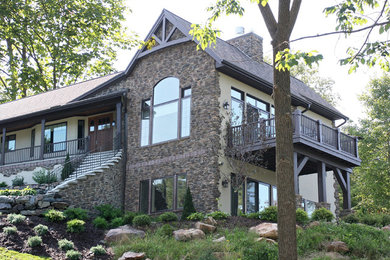 Example of a mountain style brown two-story mixed siding exterior home design in Other
