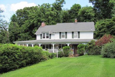 Large country white two-story wood gable roof photo in New York