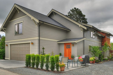 Large elegant gray two-story mixed siding gable roof photo in Seattle