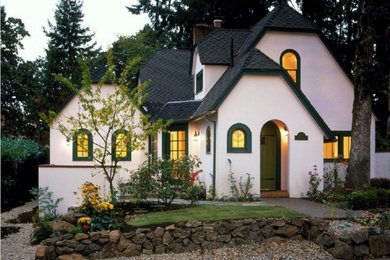 Inspiration for a timeless white two-story stucco exterior home remodel in Portland