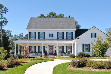 Farmhouse white two-story exterior home idea in Charleston with a mixed material roof