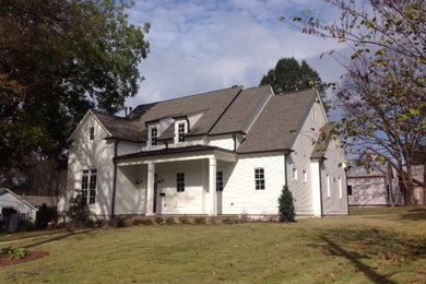Example of a mid-sized farmhouse white two-story wood gable roof design in Jacksonville