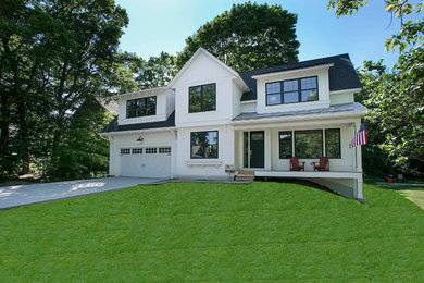 Example of a large farmhouse white two-story exterior home design in Minneapolis