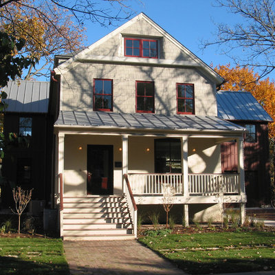 Large farmhouse three-story wood exterior home idea in Chicago