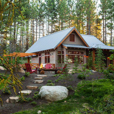 Mid-sized mountain style gray one-story wood gable roof photo in Seattle