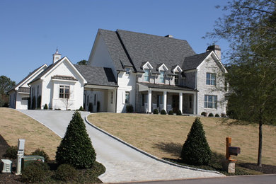 Large farmhouse multicolored two-story mixed siding exterior home photo in Atlanta with a shingle roof