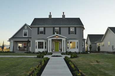 Mid-sized transitional gray two-story brick gable roof photo in Salt Lake City
