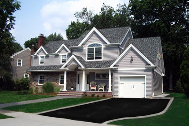 Inspiration for a mid-sized transitional gray two-story vinyl gable roof remodel in New York
