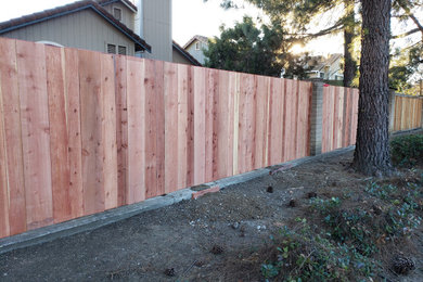 This is an example of a large traditional wood fence landscaping in Sacramento.