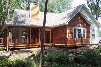 Inspiration for a medium sized classic bungalow house exterior in Grand Rapids with wood cladding.