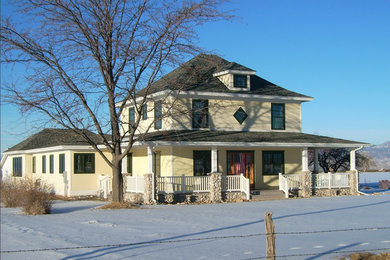 This is an example of a medium sized and white traditional two floor render detached house in Denver.