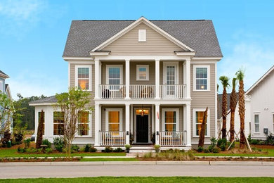 Inspiration for a large transitional beige two-story wood exterior home remodel in Charleston
