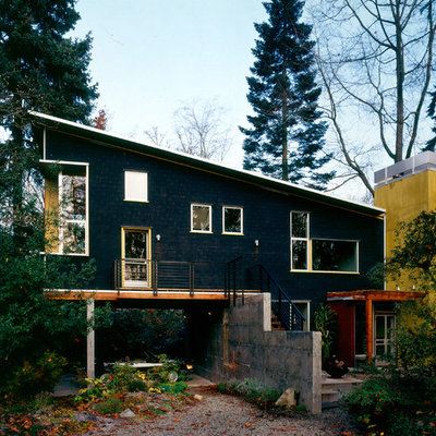 Contemporary black two-story exterior home idea in Seattle with a shed roof