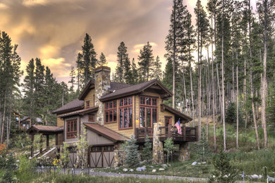 Inspiration for a large rustic two-story wood gable roof remodel in Denver