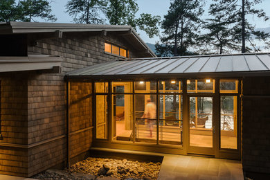 Inspiration for a mid-sized modern brown two-story wood exterior home remodel in Atlanta with a metal roof