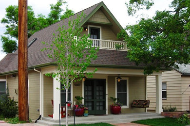 Inspiration for a small timeless beige two-story mixed siding gable roof remodel in Denver