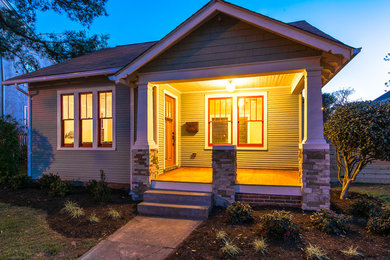 Medium sized and green classic bungalow house exterior in Richmond with wood cladding.