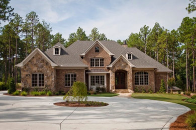 Inspiration for a timeless stone exterior home remodel in Raleigh