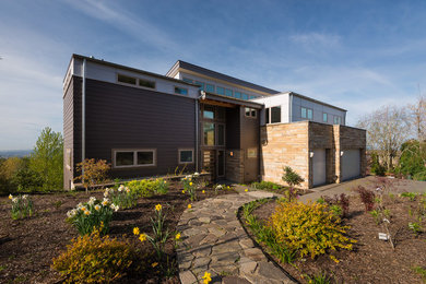 Contemporary gray two-story wood exterior home idea in Portland