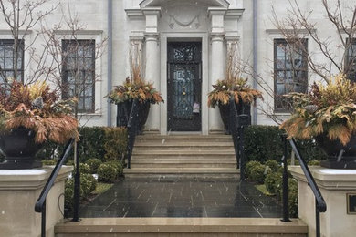 Inspiration for a large and beige two floor detached house in Toronto with stone cladding, a hip roof and a metal roof.