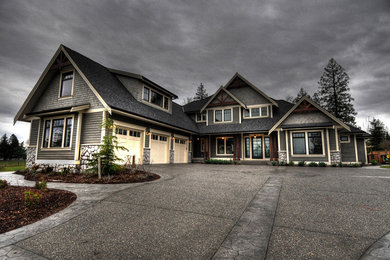 Inspiration for a large craftsman gray three-story mixed siding gable roof remodel in Vancouver