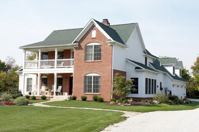 Inspiration for a large country white two-story mixed siding gable roof remodel in Indianapolis