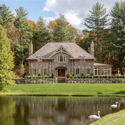 Inspiration for a timeless stone exterior home remodel in Philadelphia with a hip roof