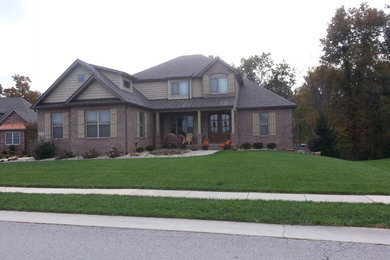 Example of an arts and crafts exterior home design in St Louis