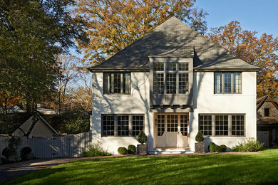 Example of a transitional white three-story brick exterior home design in Charlotte