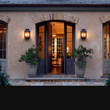 Entry Rustic French Country Home with Stucco and Stone