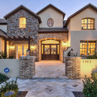Inspiration for a farmhouse beige two-story mixed siding exterior home remodel in Phoenix with a hip roof