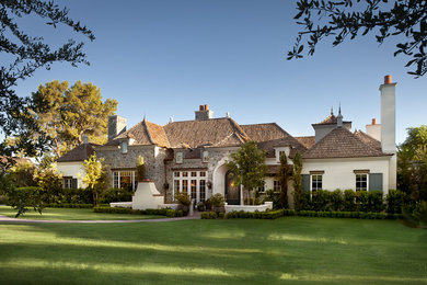Example of a french country exterior home design in Phoenix