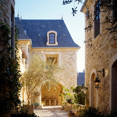Elegant stone exterior home photo in Los Angeles
