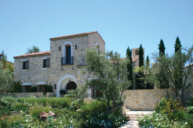 Example of a large country two-story house exterior design in Orange County