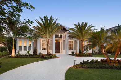 Large transitional brown one-story exterior home idea in Miami