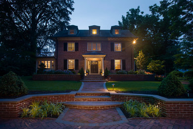 Example of a large classic red two-story brick exterior home design in Philadelphia with a shingle roof