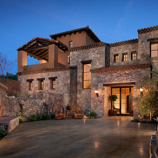 Mediterranean stone exterior home idea in Phoenix